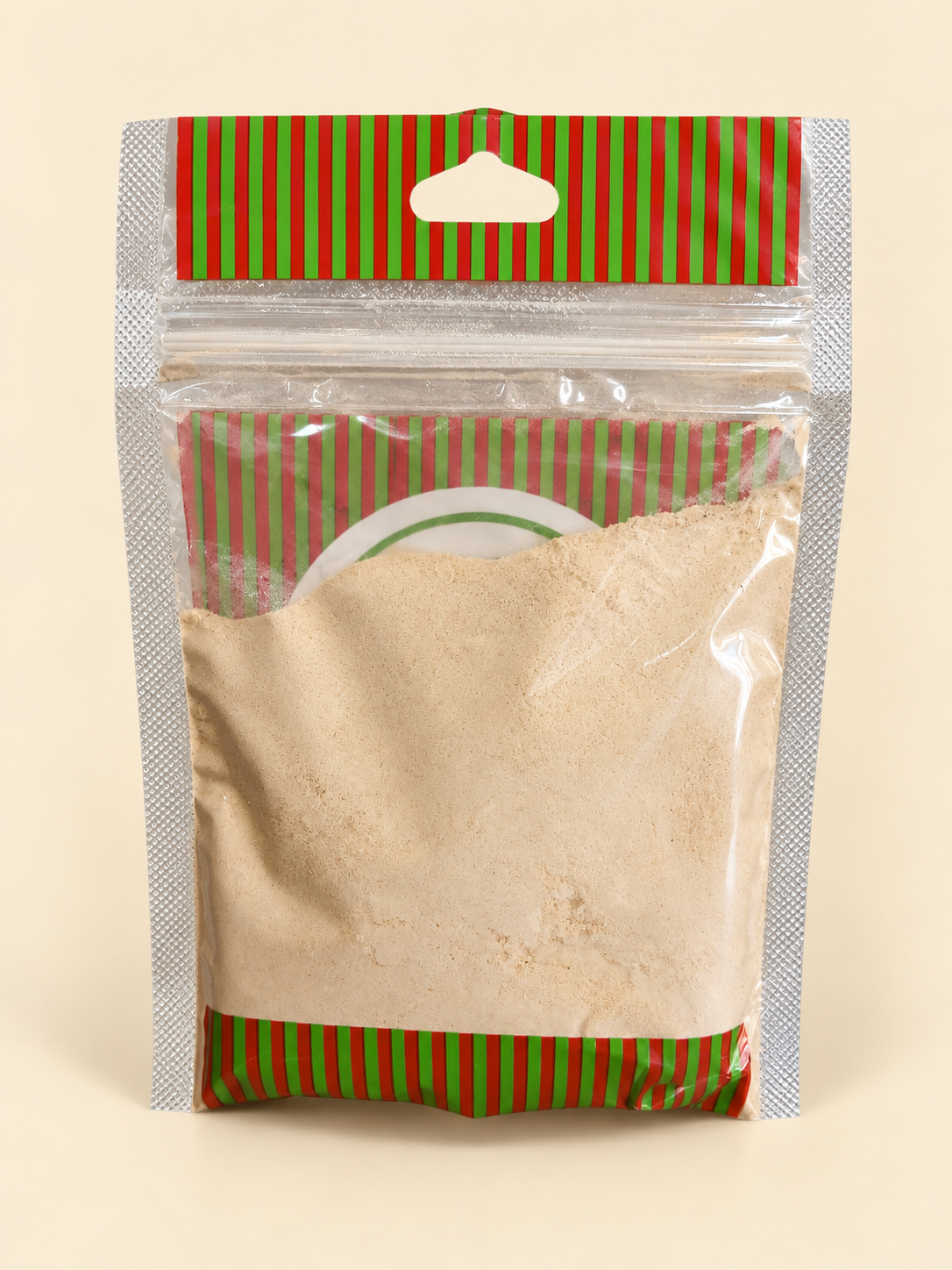 Ajo en polvo, presentación de 50 g: dorso del envase sobre fondo crema.