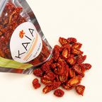 Bolsa KAIA de tomates cherry deshidratados con provenzal y detalle del producto sobre fondo crema.