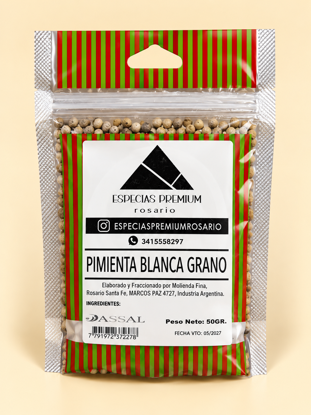 Pimienta blanca en grano, presentación de 50 g: frente del envase sobre fondo crema.