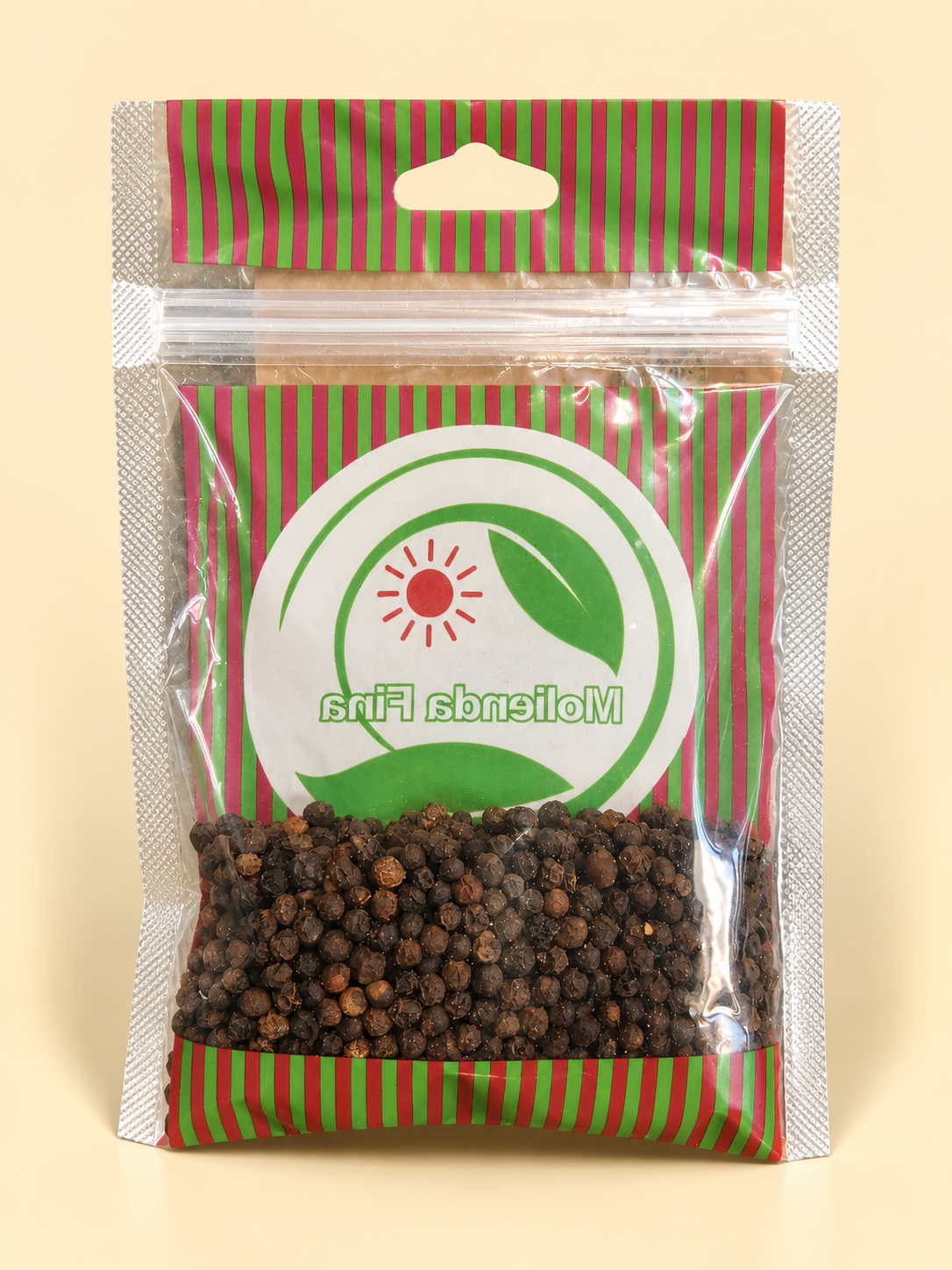 Pimienta negra en grano, presentación de 50 g: dorso del envase sobre fondo crema.